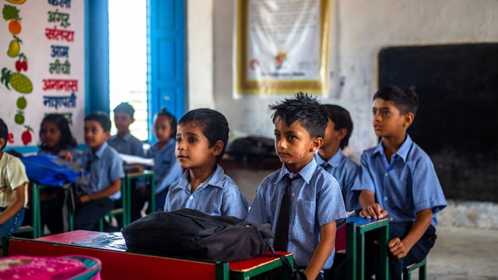 Schoolchildren at their desks in a classroom